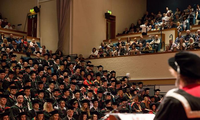A busy audience at a graduation event